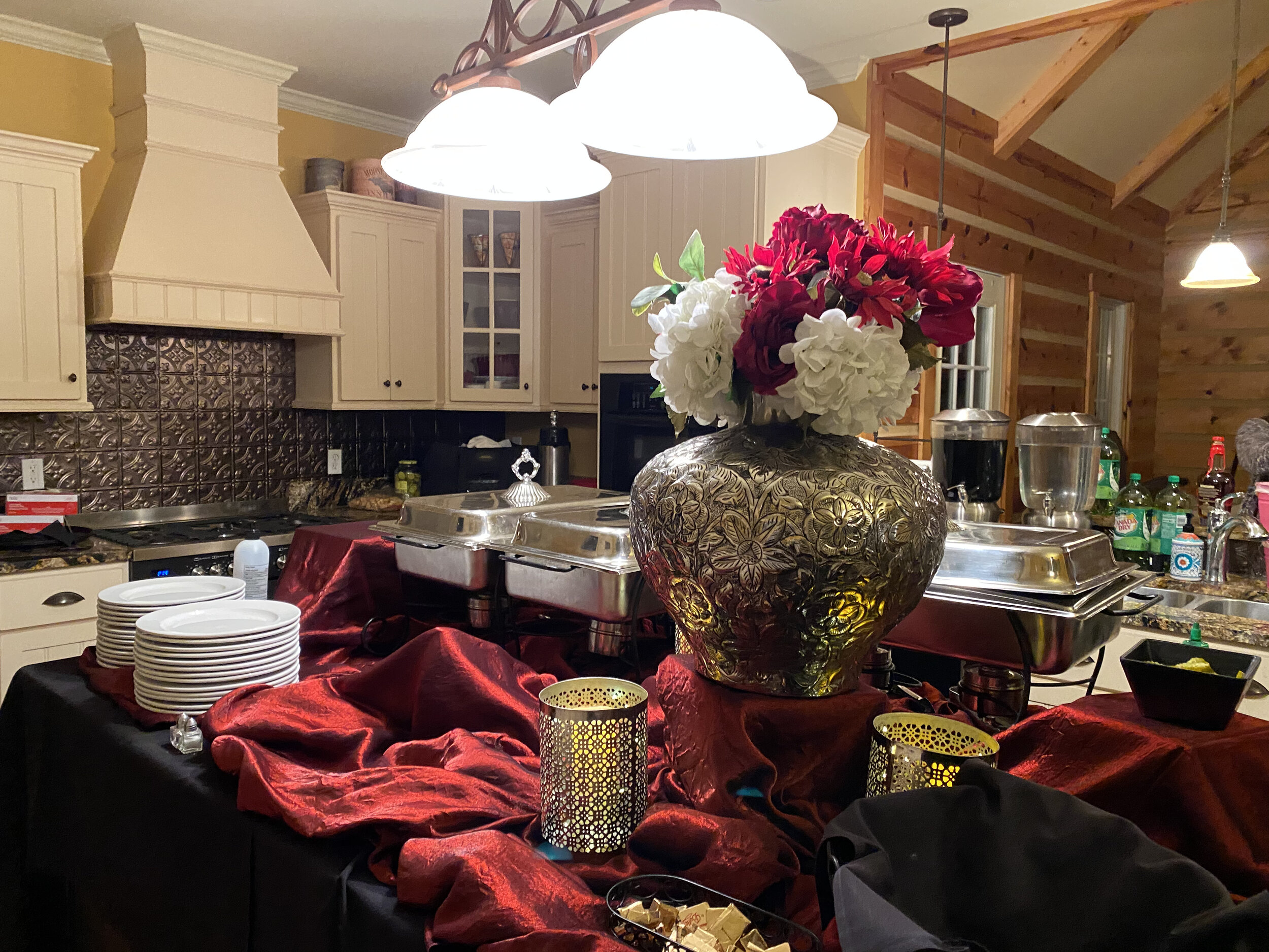 Kitchen with catered buffet on center island